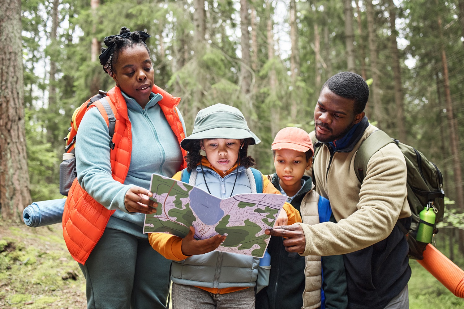 Family with young children exploring a travel destination with a planned itinerary