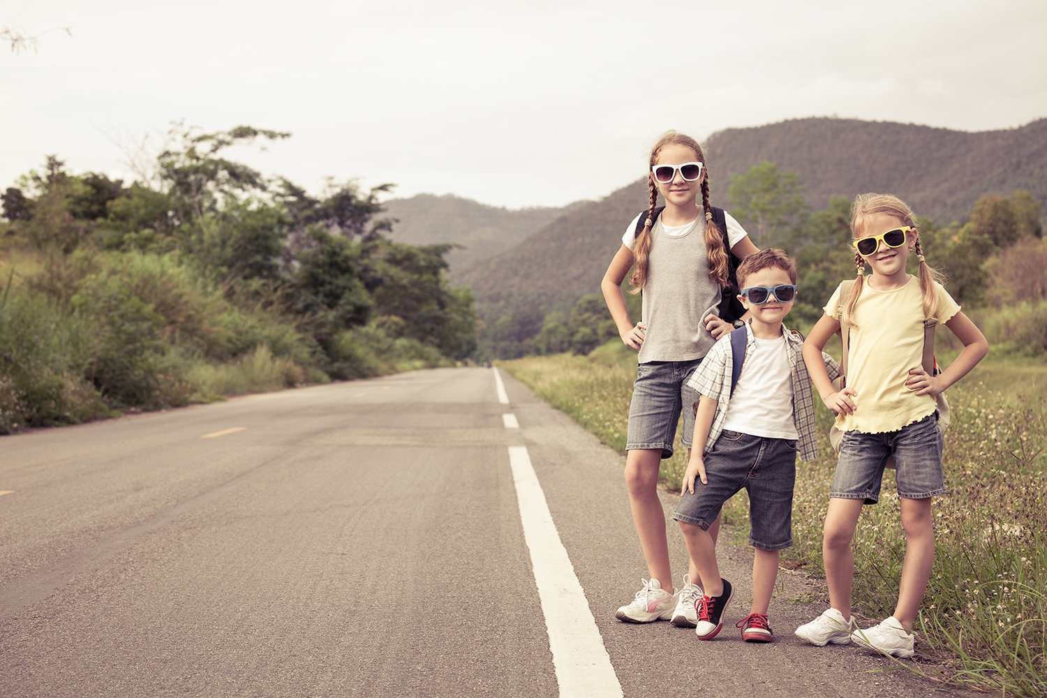 Open scenic road through desert mountains representing smoother family travel flow