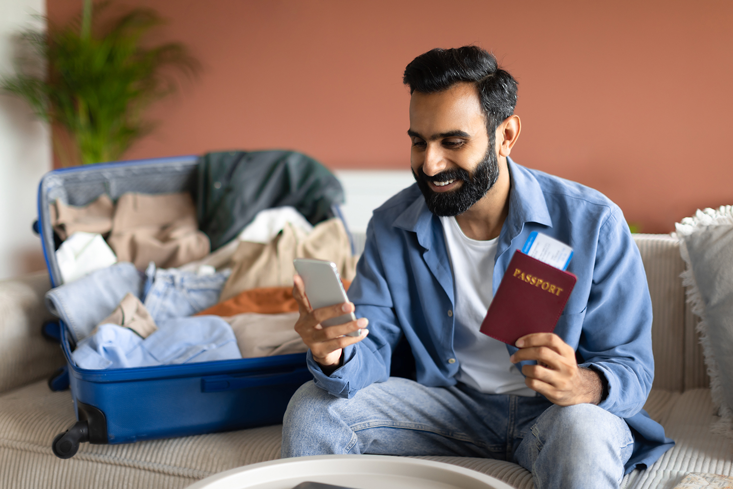 Traveller checking visa requirements and passport before an international trip